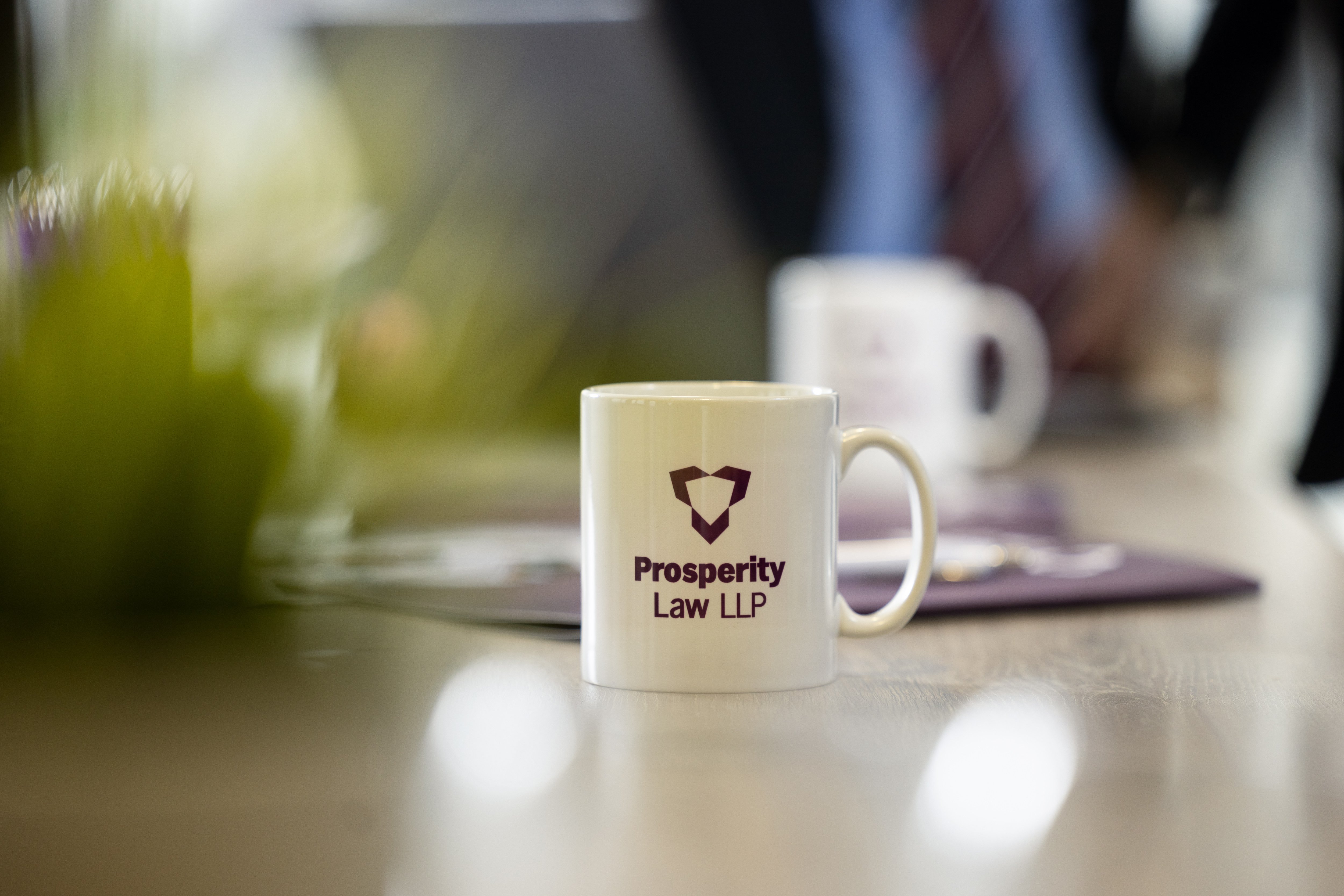 prosperity law mug on a desk